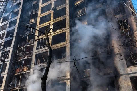 War in Ukraine. Damaged residential building in Kyiv Stock Photos