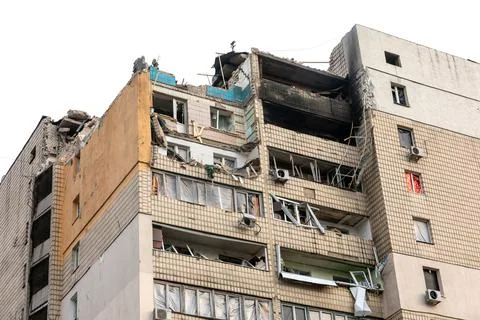 War in Ukraine. Damaged residential building Stock Photos