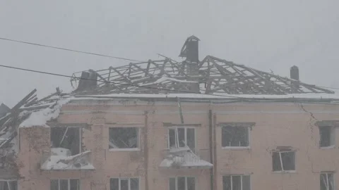 War in Ukraine, Destroyed building, winter day, first snow Stock Footage 258661799