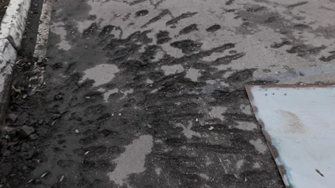 War in Ukraine. A shell explosion crater in the asphalt Видео 196736940