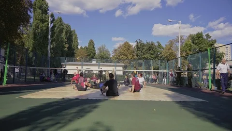 War veterans play sit-down volleyball on the court. Handicapped in sport. 스톡 동영상 120704716