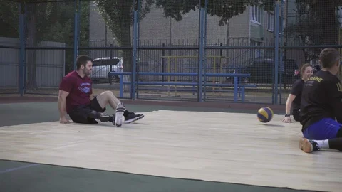 War veterans play sit-down volleyball on the court. Handicapped in sport. 스톡 동영상 120775945