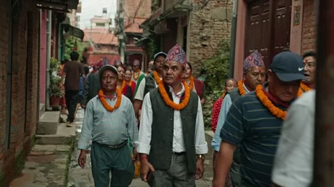 Ward Office Staff Walking to Temple during Gai Jatra in Harisiddhi, Nepal Stock Footage 318718078