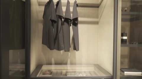 Wardrobe with clothes and pull-out shelves Stock Footage 270163788