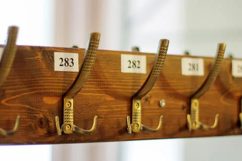 Wardrobe, clothes hooks are numbered. coat rack with hooks for coats and jack 写真素材