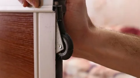 Wardrobe door rollers Stock Footage 171929689