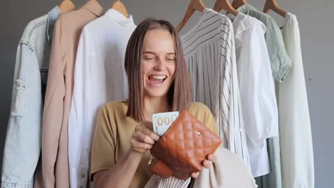 Wardrobe essentials. Satisfied positive happy cheerful beautiful woman shop.. 動画素材 252280888