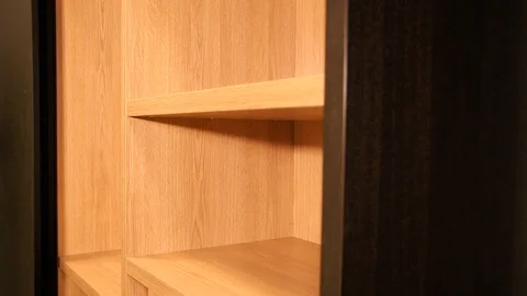 Wardrobe inside. Modern wardrobe. Cabinet shelf. Wooden shelves Stock Footage 125422372