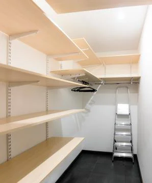 Wardrobe with shelves and ladder Stock Photos