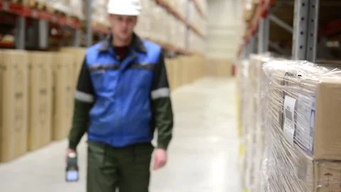 Warehose worker using bar code scanner at storehouse 動画素材 84118222