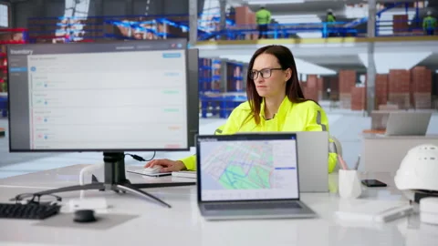 Warehouse Analyst Using Desktop Computer Stock Footage 331159115