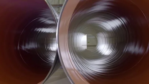 Warehouse with big diameter pipes stacked on the floor. Video stock 76833270