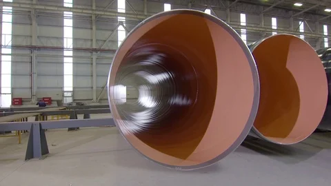 Warehouse with big diameter pipes stacked on the floor. Video stock 76835000