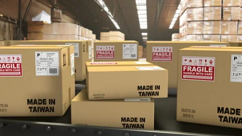 In a warehouse, boxes on a conveyor belt with the mention Made in Taiwan. Stock Footage 247758161