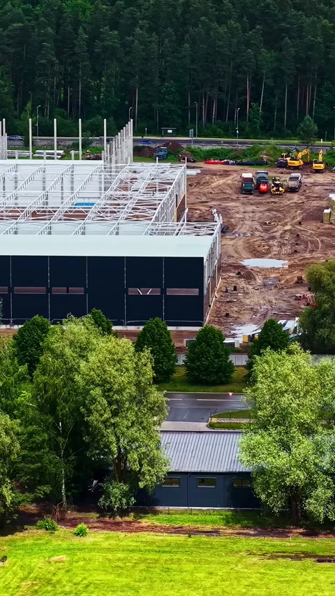Warehouse Build Next to Green Field, Aerial Pullback Video stock 341763531