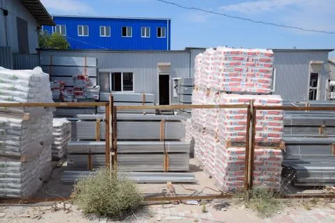 Warehouse of building materials. Building base, metal, wood and blocks with b Stock Photos