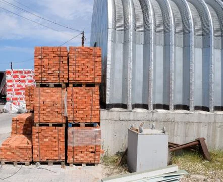 Warehouse of building materials. Building base, metal, wood and blocks with b Stock Photos