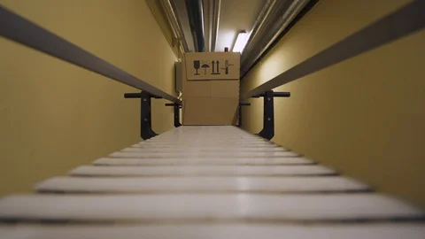 Warehouse, cardboard box is moving along the production line. Vídeo Stock 85920879