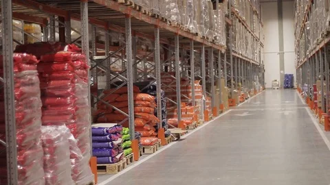Warehouse with cardboard boxes inside on pallets racks, logistic center. Видео 126269163