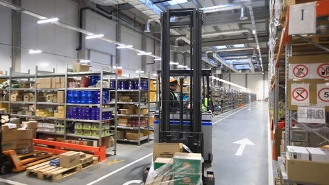 Warehouse with cardboard boxes inside on pallets racks, logistic center. 库存影片 126269172