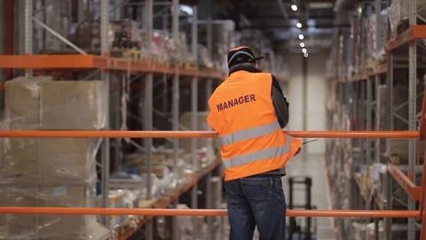 Warehouse with cardboard boxes inside on pallets racks, logistic center. Vídeo Stock 126269334