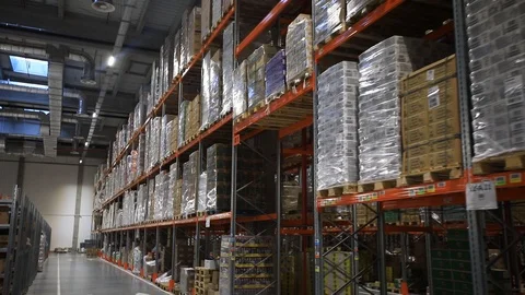 Warehouse with cardboard boxes inside on pallets racks, logistic center. Stock Footage 126269350