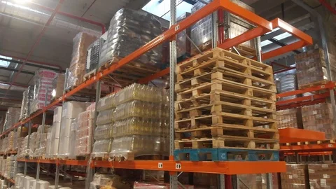 Warehouse with cardboard boxes inside on pallets racks, logistic center. Stockbeeldmateriaal 126269362