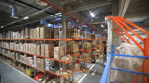 Warehouse with cardboard boxes inside on pallets racks, logistic center. Stock Footage 126269381