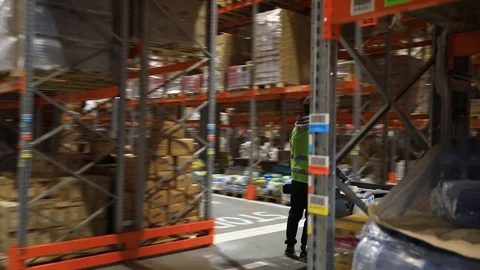 Warehouse with cardboard boxes inside on pallets racks, logistic center. Vídeo Stock 126269437