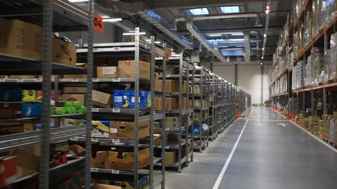 Warehouse with cardboard boxes inside on pallets racks, logistic center. Видео 126269569