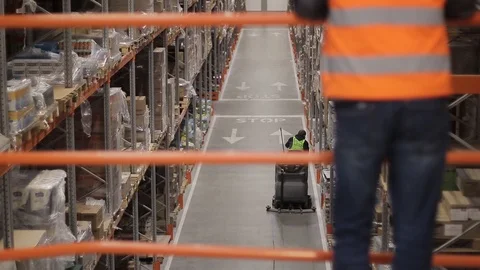Warehouse with cardboard boxes inside on pallets racks, logistic center. 動画素材 126269926