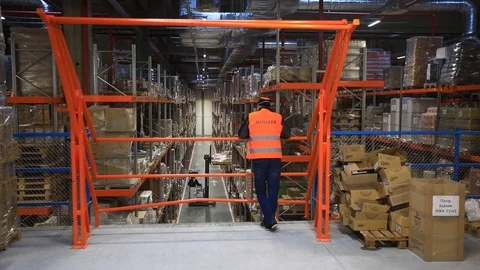 Warehouse with cardboard boxes inside on pallets racks, logistic center. Stock-Footage 126270083