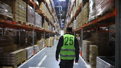Warehouse with cardboard boxes inside on pallets racks, logistic center. Vídeos de archivo 142828435