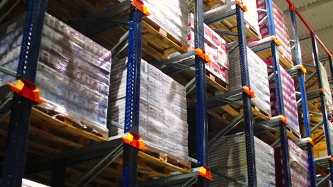 Warehouse with cardboard boxes inside on pallets racks, logistic center. Video stock 150517590