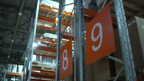 Warehouse with cardboard boxes inside on pallets racks, logistic center. Huge Stock Footage 171168431