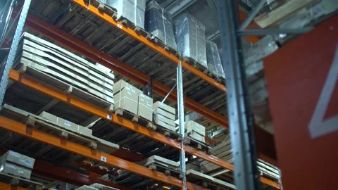 Warehouse with cardboard boxes inside on pallets racks, logistic center. Huge 스톡 동영상 172235849