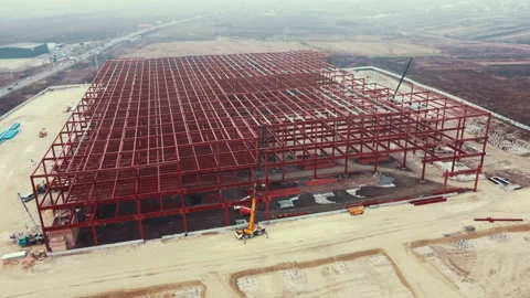 Warehouse Construction from metal structure. Industrial building on light gauge Stock Footage 168650003