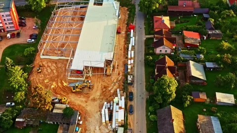 Warehouse construction next to residential homes in Smiltene, Latvia Vídeos de archivo 320767669