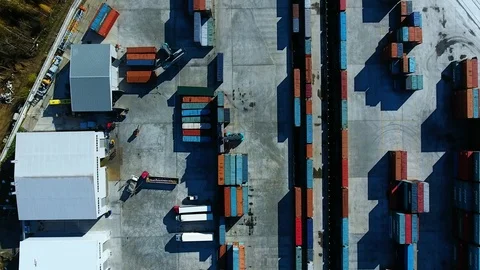 Warehouse with containers. Container Handler unload the train. aerial view Stock-Footage 97532602