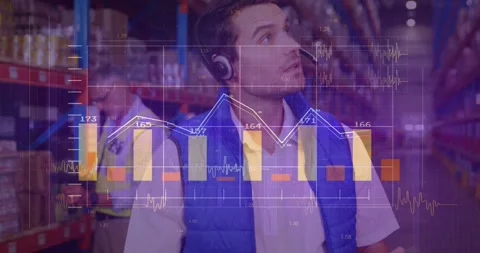 Warehouse coordinator tapping tablet screen, updating bar and line graphs for Видео 319851744