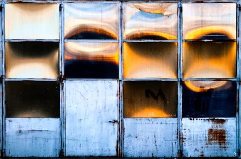 Warehouse door with sun reflections Stock Photos