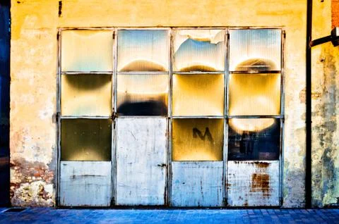 Warehouse door with sun reflections Stock Photos