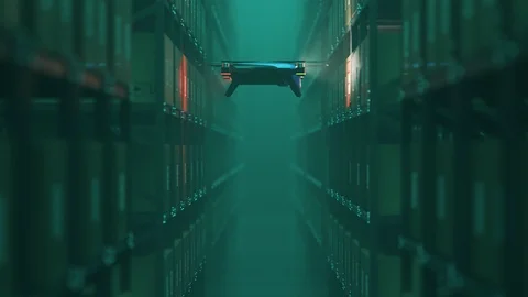 Warehouse drone scanning QR codes on the cardboard boxes in a metal shelf. Stock-Footage 100611660