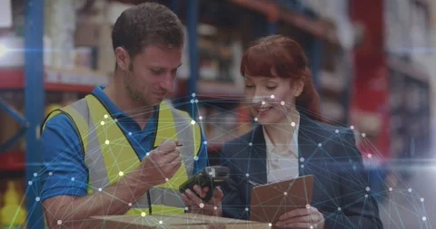 Warehouse duo tapping scanner manager noting tech overlay linking scanner to Stock Footage 330330801