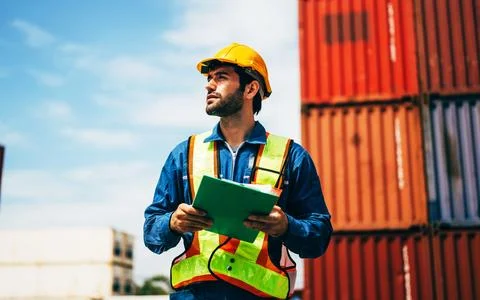 Warehouse engineer worker working at industrial container yard Stock Photos
