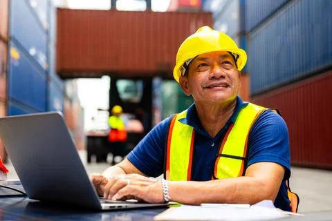 Warehouse engineer worker working at industrial container yard Stock Photos