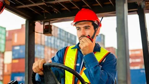 Warehouse engineer worker working at industrial container yard Stock Photos
