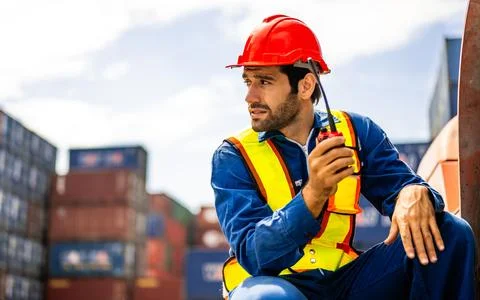 Warehouse engineer worker working at industrial container yard Stock Photos