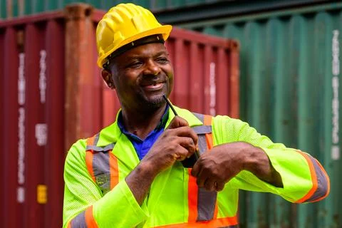 Warehouse engineer working at container yard Stock Photos