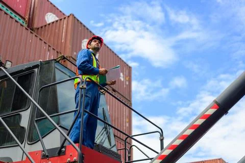Warehouse engineer working at container yard Stock Photos